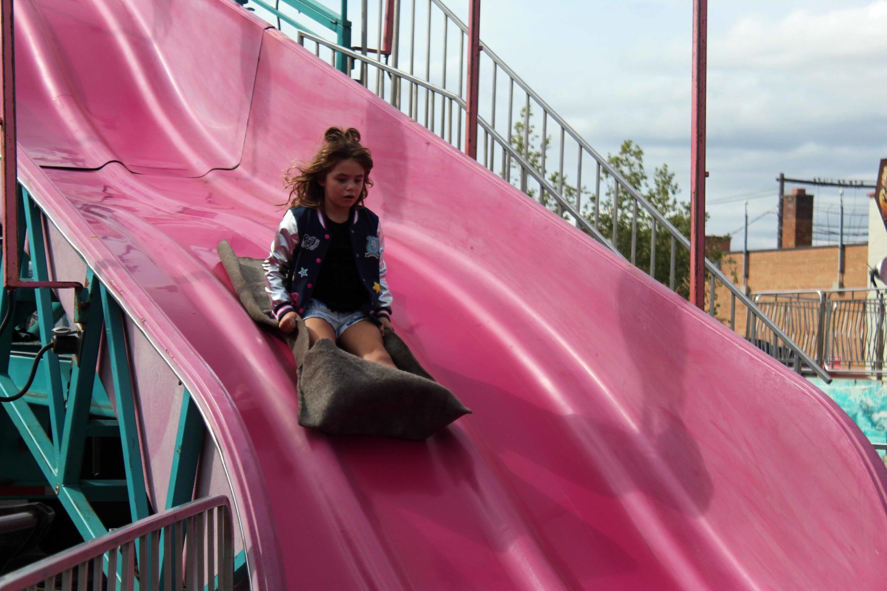 Charlotte goes down slide